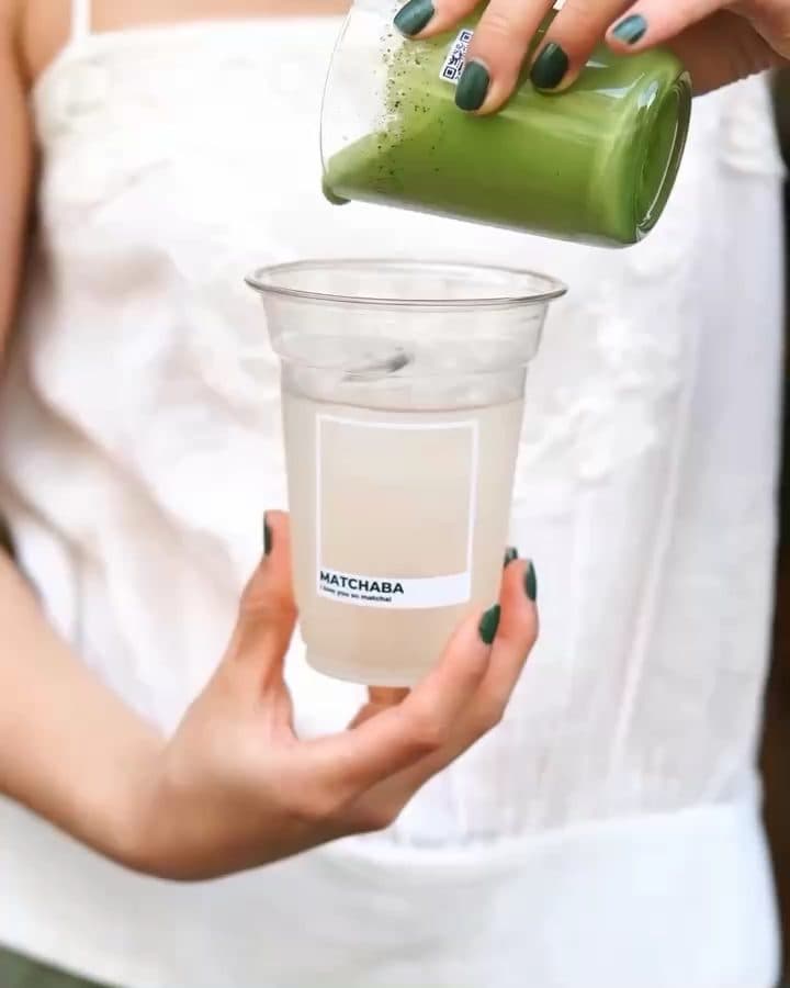 Matcha poured into a cup with the MatchaBa label